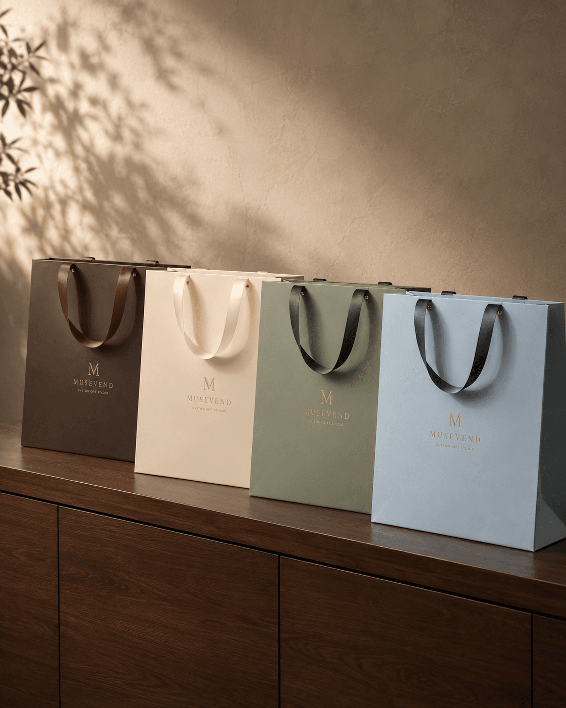 Custom gift bags in brown, cream, sage, and light blue colorways