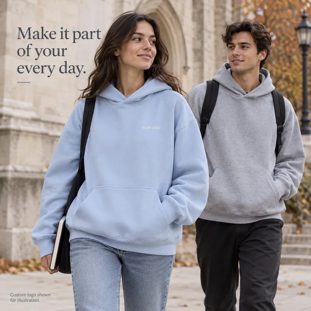 Two adult students wearing sky blue and gray hoodies on a campus
